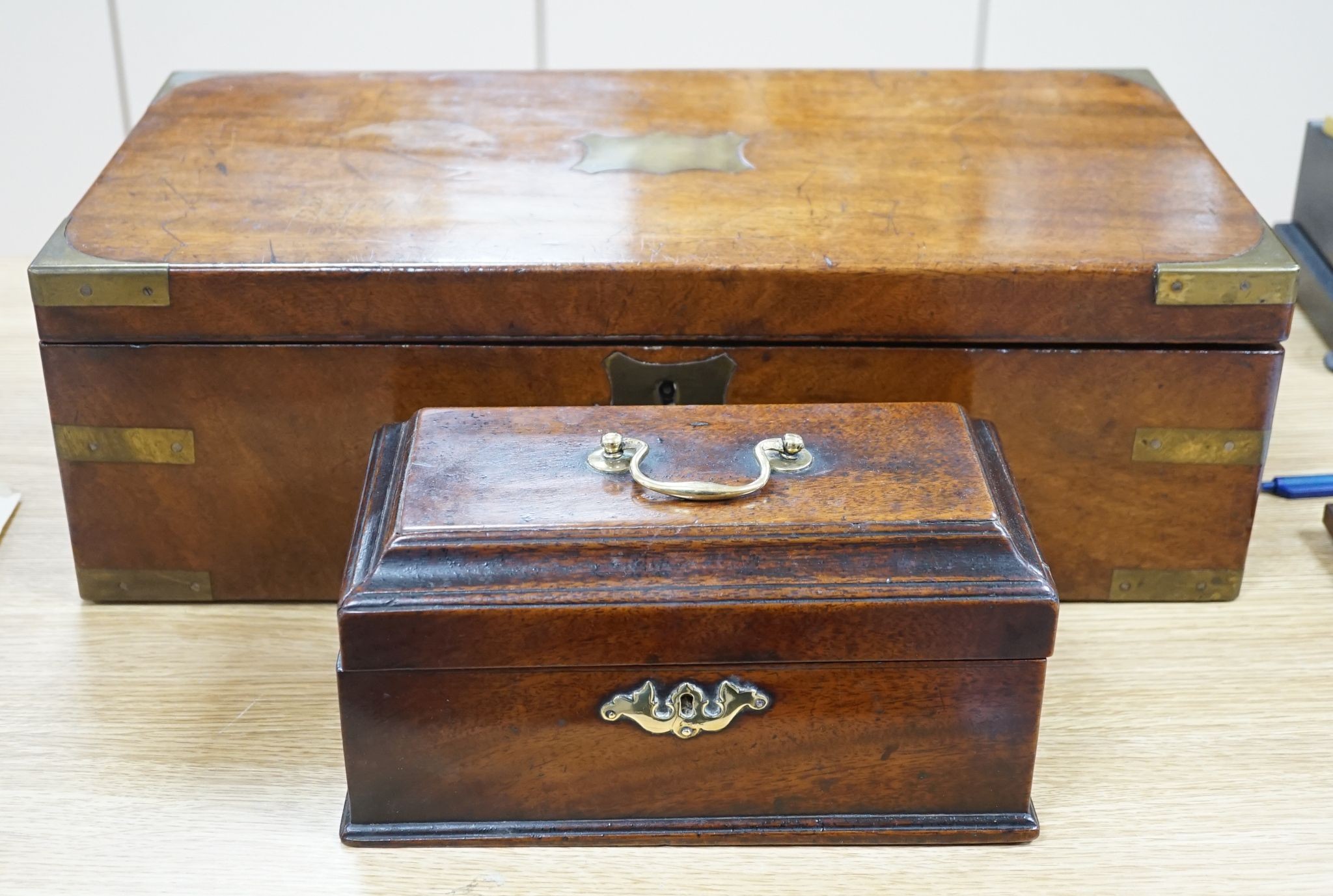 A Victorian mahogany writing slope and Chippendale-period mahogany tea caddy, Writing slope 50 cms wide.